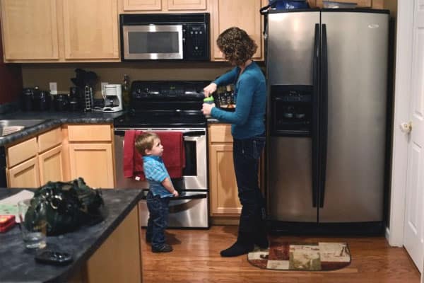 Amy Tucker prepares a bottle of milk for her 2 year-old son, Grant, at their home in Columbia, Ill., on Oct. 17, 2012. Amy had an ovary removed and frozen in 1998 before a cancer treatment. In 2009, the ovarian tissue was returned and she became pregnant with Grant.