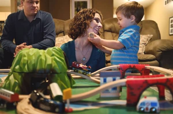 Amy Tucker and her husband, Jason Tucker, play with their 2-year-old son, Grant, at their home in Columbia, Ill., on Oct. 17, 2012. Amy had an ovary removed and frozen in 1998 before a cancer treatment. In 2009, the ovarian tissue was returned and she became pregnant with Grant.