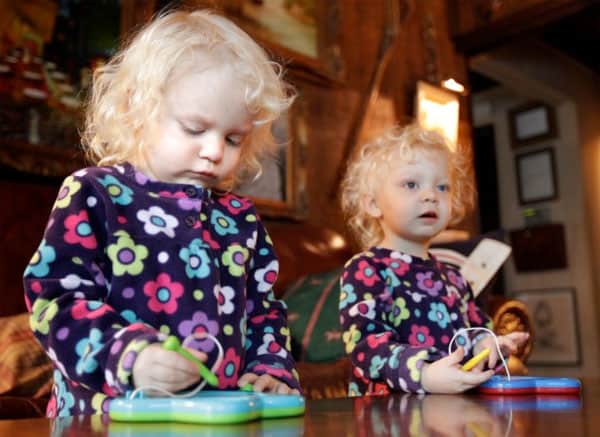 Twins Darby, left, and Reagan Christian play with drawing toys in their Belleville home Monday Dec. 26, 2011. The girls were conceived by parents Fred and Linda Christian through mini in vitro fertilization, a procedure advocated by St. Louis doctor Sherman Silber which, he says, is safer, cheaper and easier on women while maintaining comparable pregnancy rates. 