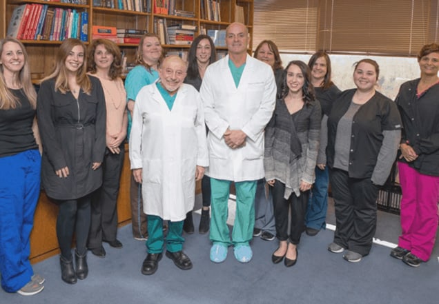 Dr. Silber and Dr. DeRosa with their team of IVF coordinators, nurses, and staff